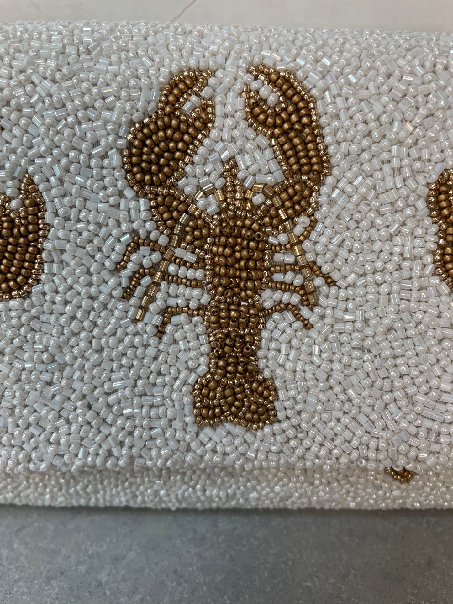 LOBSTER CLUTCH WHITE AND GOLD