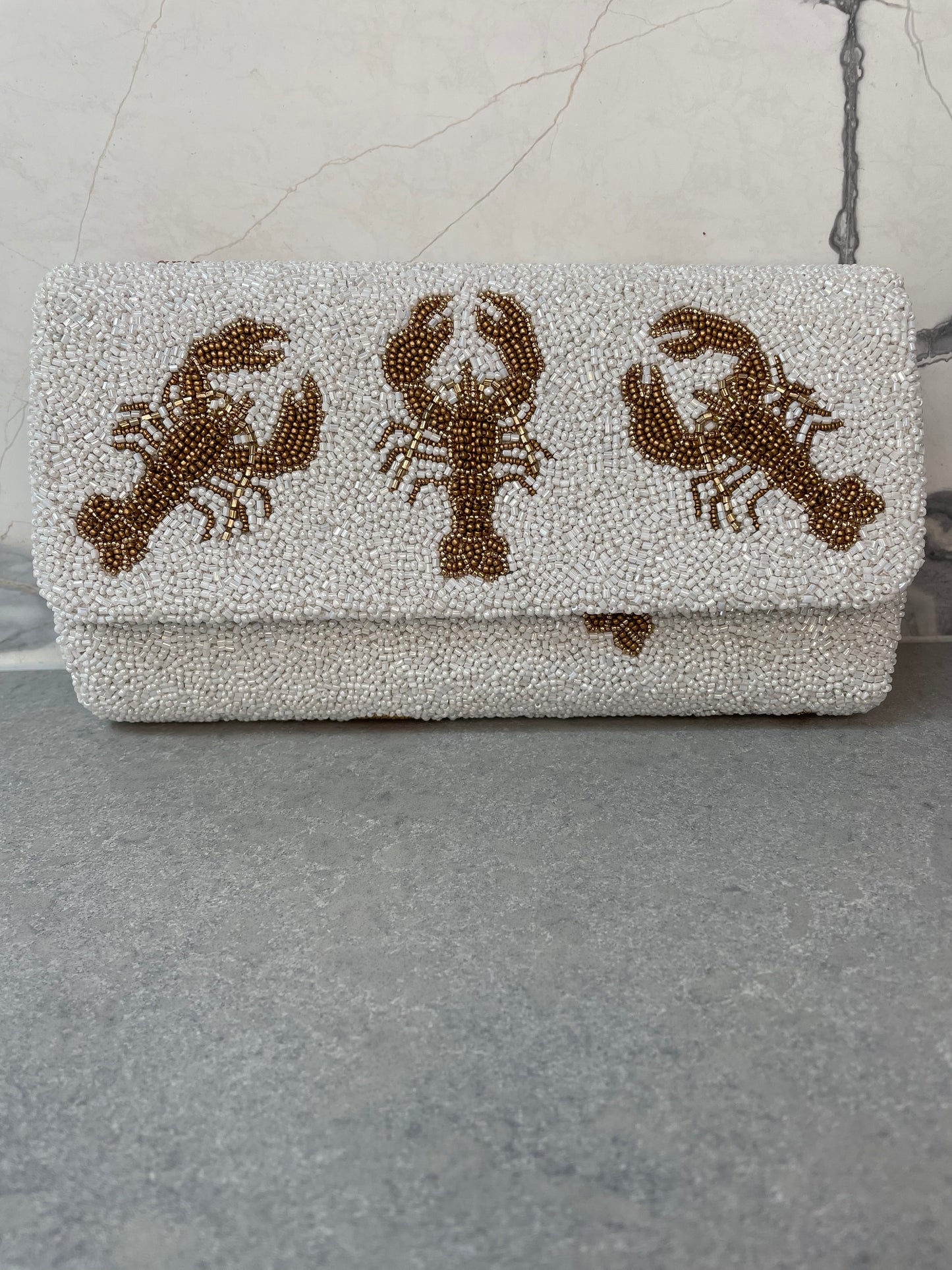 LOBSTER CLUTCH WHITE AND GOLD